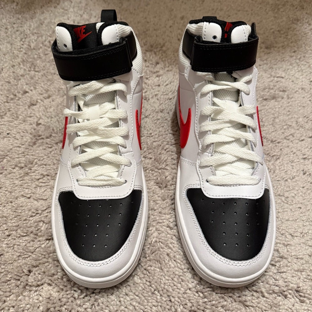 White and Black High-Top Sneakers with Red Accents